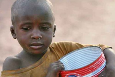 Talibe boy begging in Dakar.