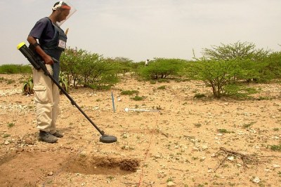 A de-mining official uses a metal detector to check for landmines in Somaliland.