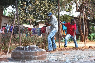 Sewage overflows outside homes in Kuwadzana 3 township in Harare (file photo).