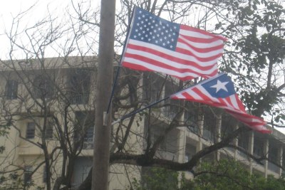 The Liberian and American flags being hoisted in Monrovia streets (file photo).