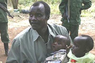 Lord's Resistance Army (LRA) leader Major General Joseph Kony, holds his daughter, Lacot, and son, Opiyo, at a past peace negotiation.