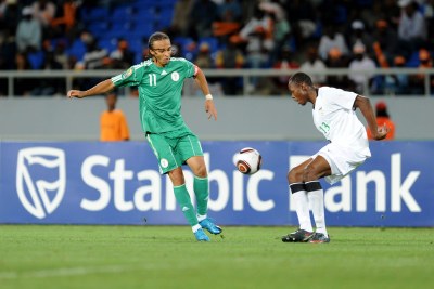 Peter Odemwingie of Nigeria, left, seen challenging Stophira Sunzu of Zambia, has pleaded with impatient Nigerian fans to give the Eagles more room to improve.