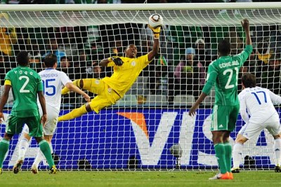 Vincent Enyeama of Nigeria saves a close range shot from Vasileios Torosidis of Greece at the 2010 World Cup.