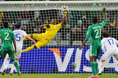 Vincent Enyeama of Nigeria saves a close-range shot from Vasileios Torosidis of Greece.