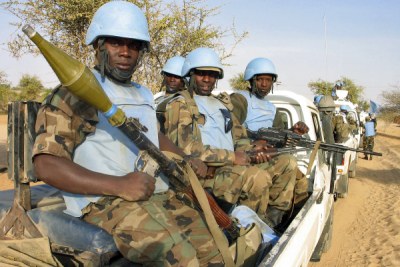 Peacekeeping force guards supply convoy of soldiers from the joint African Union United Nations Mission in Darfur (UNAMID).