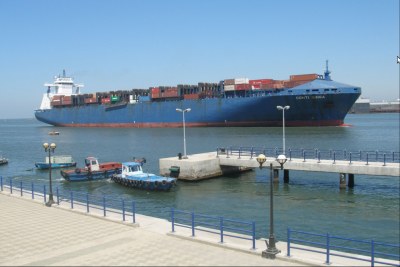 A cargo ship passes through the Suez Canal.