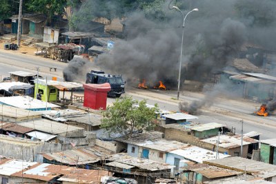 Smoke billows from the streets of Abidjan during Cote d'Ivoire's post-election crisis.