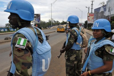 UNMIL Peacekeepers backing the Liberian National Police.