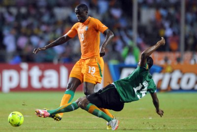 African player of the year for 2012 Yaya Toure - seen, left, against Stoppila Sunzu of Zambia at the last Afcon finals - will join Cote d'Ivoire's team at the 2013 finals in South Africa.