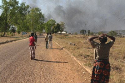 A rocket explosion and unknown gunmen again hit Jos