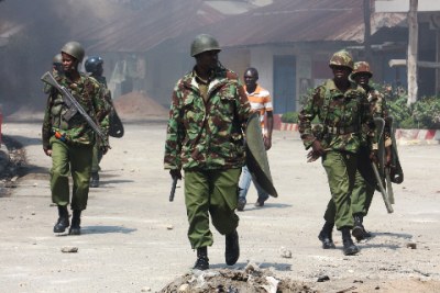 Police officers patrol along Majengo area near Masjid Musa mosque where youth attacked a Muslim cleric (file photo).