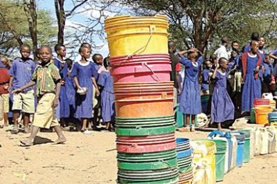 Pupils queue to fetch clean water in Yaeda Chini Valley (file photo).