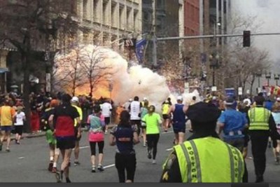 The second of two bombs explodes near the finish line of the Boston Marathon.