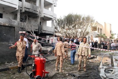 Libyan security personnel gather outside the French embassy following a car bomb blast, in Tripoli.