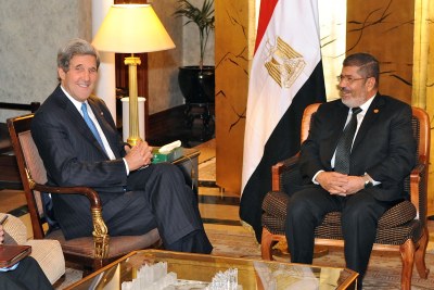U.S. Secretary of State John Kerry meets ousted President Mohamed Mursi (file photo).