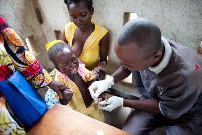 A young child is given a malaria rapid test at a hospital in Bossangoa, Central African Republic.