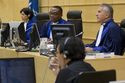Judge Chile Eboe-Osuji of Nigeria is presiding at the Ruto trial, assisted by judges Olga Herrera Carbuccia of the Dominican Republic, left, and Robert Fremr of the Czech Republic, right.