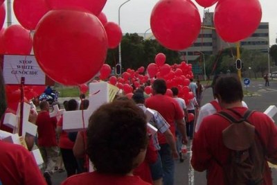 Protesters  in Pretoria, South Africa, released red balloons during their demonstration against crime.