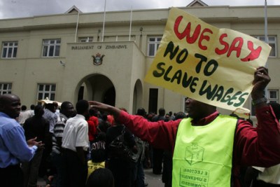 Civil servants protesting poor wages outside parliament (file photo).