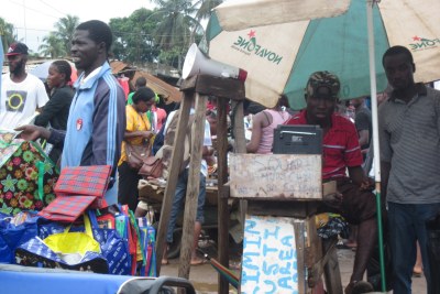 Street hawkers sell in Monrovia's densely populated New Kru Town community, where seven people reportedly died from the deadly Ebola virus.