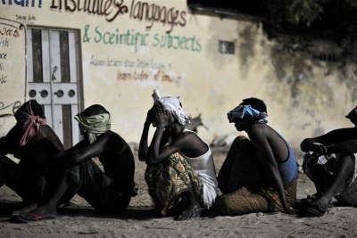 Suspected al-Shabaab militants wait to be taken for interogation during a joint night operation by the Somali security services and the African Union Mission in Somalia (AMISOM), in Mogadishu.