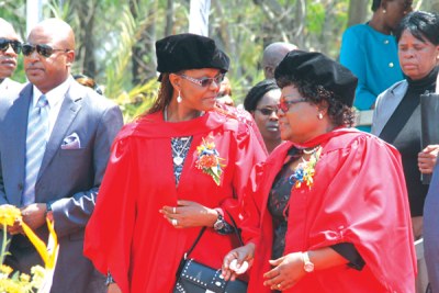 First Lady Grace Mugabe and Vice President Joyce Mujuru during her graduation ceremony.