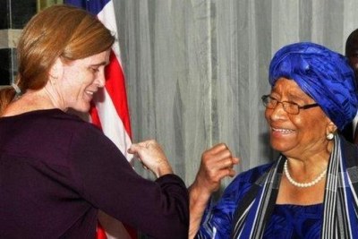 Bumping elbows—vs shaking hands—Ambassador Power with the Liberian President Sirleaf. A key part of #EbolaResponse is changing behavior.