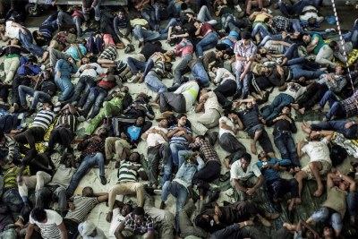 Rescued migrants sleep after being plucked from a boat off the coast of Italy in summer 2014. Most boat arrivals in 2014 were asylum seekers from Syria, Eritrea and elsewhere.