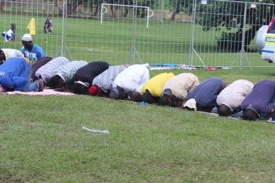 Migrants in Durban, South Africa, praying for their safety during xenophobic violence.