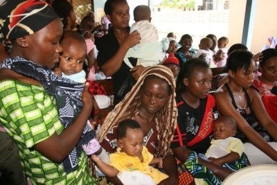 Women and their children visit a clinic at Sinza Health Centre in Tanzania's capital Dar es Salaam.