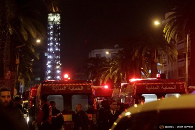 Police and ambulances are pictured near the scene of a bombing of a military bus in Tunis, Tunisia.