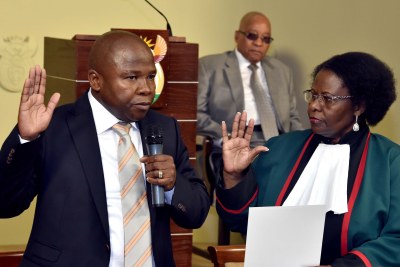 Justice Sisi Khampepe swears in Mr David Douglas Des van Rooyen as Minister of Finance while President Jacob Zuma looks on at the Union Buildings in Pretoria.