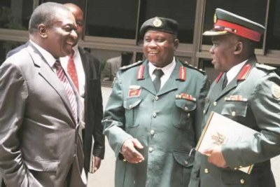 Vice President Emmerson Mnangagwa  (left) chats to Zimbabwe Staff College Commandant Brigadier General Josphat Kudumba (centre) and chief instructor Colonel Francis Chakauya in Harare.