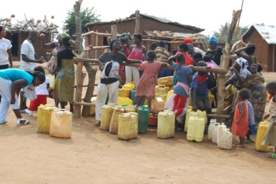 Residents waiting to draw water in Dar es Salaam (file photo).