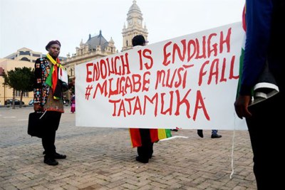 Zimbabweans protest against President Robert Mugabe.
