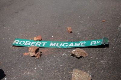 Vandalized Robert Mugabe street road sign.