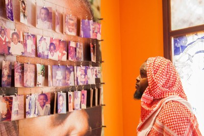 A visitor looks at photos of children killed during the 1994 Genocide against Tutsis at Kigali Memorial Centre in Gisozi (file photo)