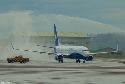 Africa's first Wi-Fi-connected Boeing 737-800NG, the pride of national carrier RwandAir, is welcomed by the fireman salute at Kigali International Airport yesterday.