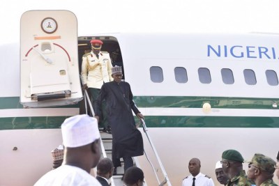 President Buhari arriving from London (file photo).