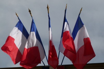 Multiple French flags as commonly flown from public buildings (file photo).