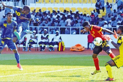 Tanzania's  Serengeti Boys striker Kelvin Naftal heads the ball past Angola goalkeeper Nsesani Simao to open the scoring during their Group B match at the U-17 Africa Cup of Nations (AFCON) 2017 at the Stade de l'Amitie Stadium in Brazzaville, Gabon. Boys won 2-1.