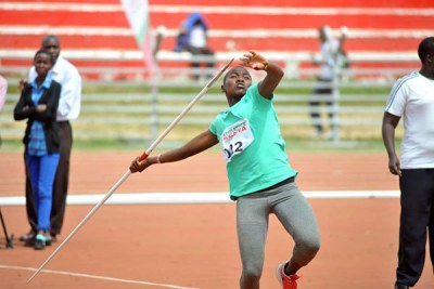 Cynthia Chebet makes a thrown during the World Under -18 Championship trials at Nyayo Stadium .