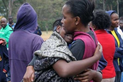 Relatives of students at Moi Girls School Nairobi in tears after a fire burnt a dormitory leaving 8 students dead and 10 others injured.