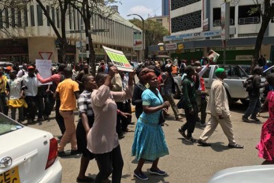 Nasa supporters march past City Hall as they head to Uhuru Park