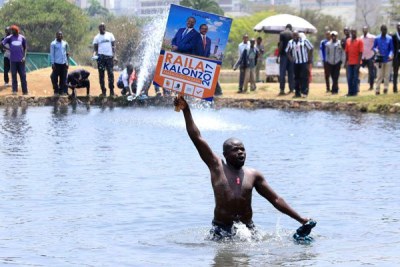 Nasa supporter protests inside a pool at Uhuru Park, Nairobi, on October 11, 2017.