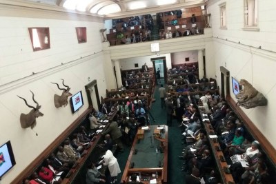 The House is almost full as the Speaker of Parliament, Jacob Mudenda walks in. Some opposition backbenchers shout 