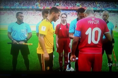 Belgium and Tunisia team captains toss the coin before their match at World Cup 2018.