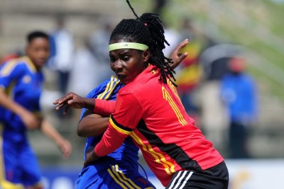 Hasifah Nassuna of Uganda is challenged by Nombuso Mamba of Swaziland during the 2018 Cosafa Womens Championship game between Swaziland and Uganda at Wolfson Stadium in Port Elizabeth on 12 September 2018.