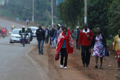 Kenyans in Nyeri County walk to their destinations.