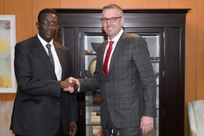 MCC COO and Head of Agency Jonathan Nash and Senegalese Minister of Economy, Finance and Planning Amadou Ba shake hands during the ceremony to mark the signing of the MCC Senegal Power Compact at the State Department.
